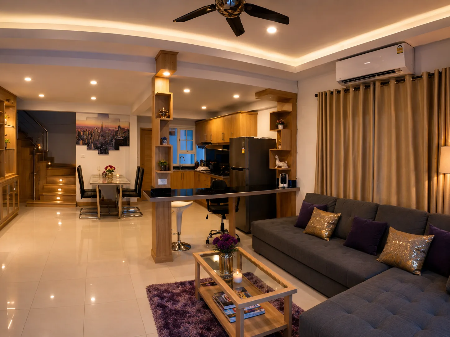 Open-plan living area with sectional sofa and staircase